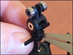 Remove the metal holding pin