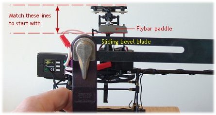 Checking the flybar paddle pitch with a carpenter's bevel Checking the flybar paddle pitch