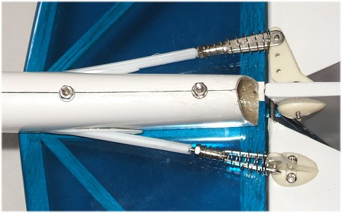 Both tail components are held in place by nuts on to threaded rods